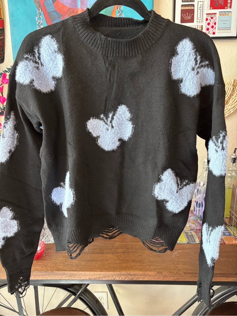 Black Crewneck Sweater with Light Blue Butterfly Motif (Size: Small)